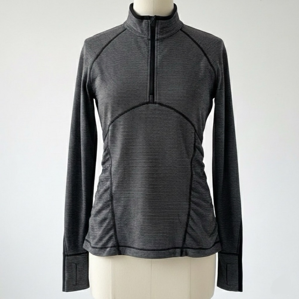 Hold Lululemon half zip athletic top hidden pocket
